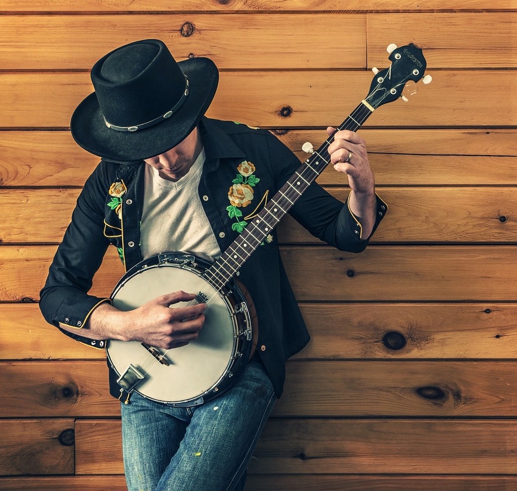 Banjo player against wooden wall image
